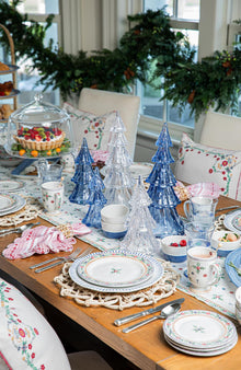 An alpine tablescape in white and blue with accents of red.