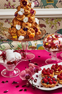 Variety of pastries displayed in Juliska glassware and serveware on a festive table