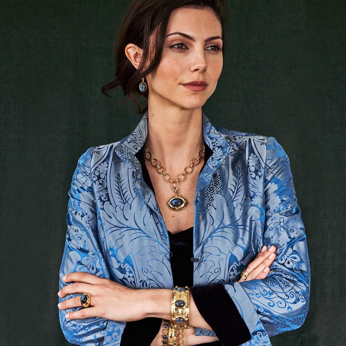 Woman modeling the cleopatra jewelry from the capucine de wulf collection 